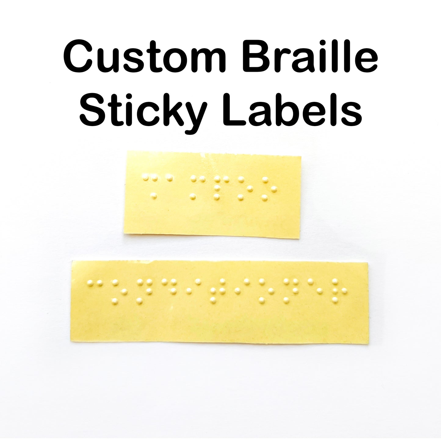 A white box with text across the top saying Custom Braille Sticky Labels, there are two yellow backed braille labels in the middle saying shampoo and conditioner.