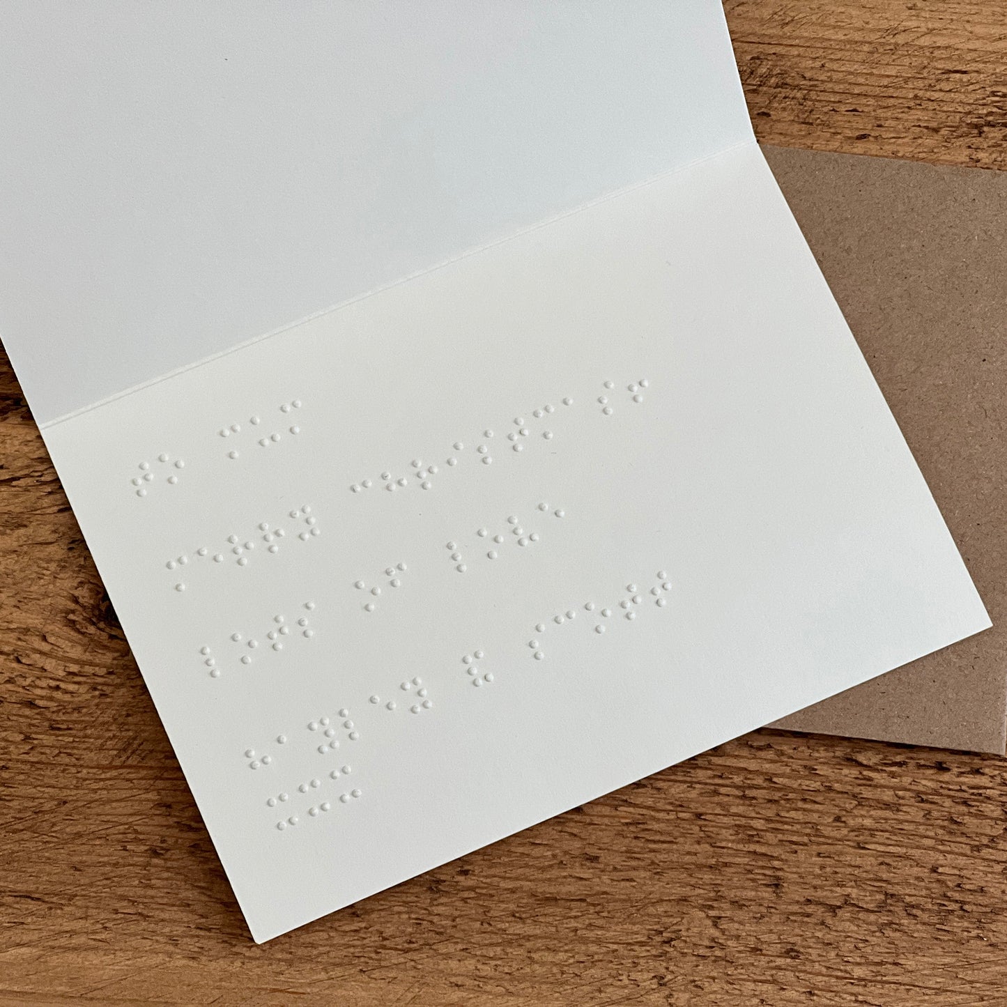 The inside of a card with a braille message.