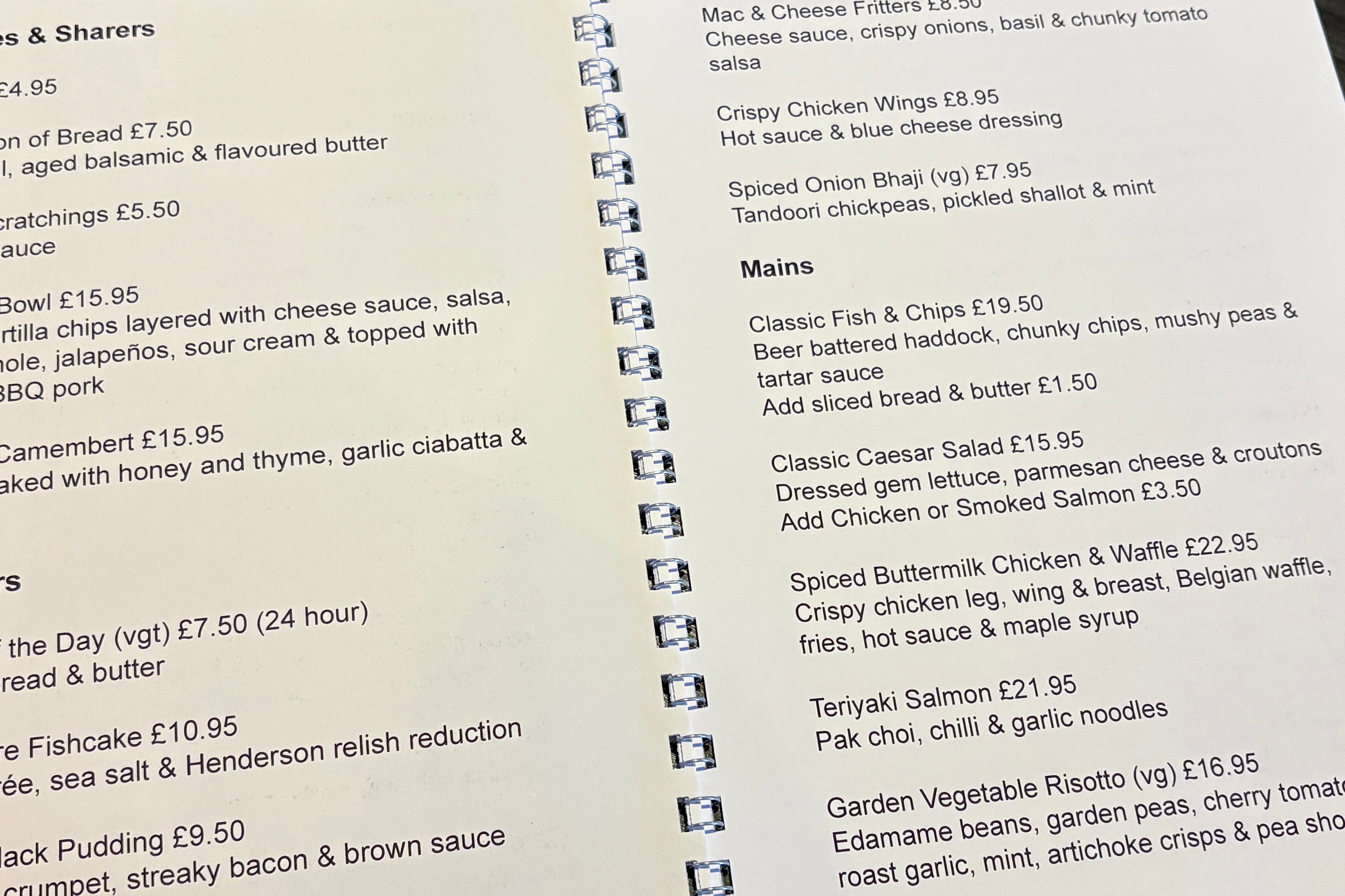 Close up of a wire bound large print menu.